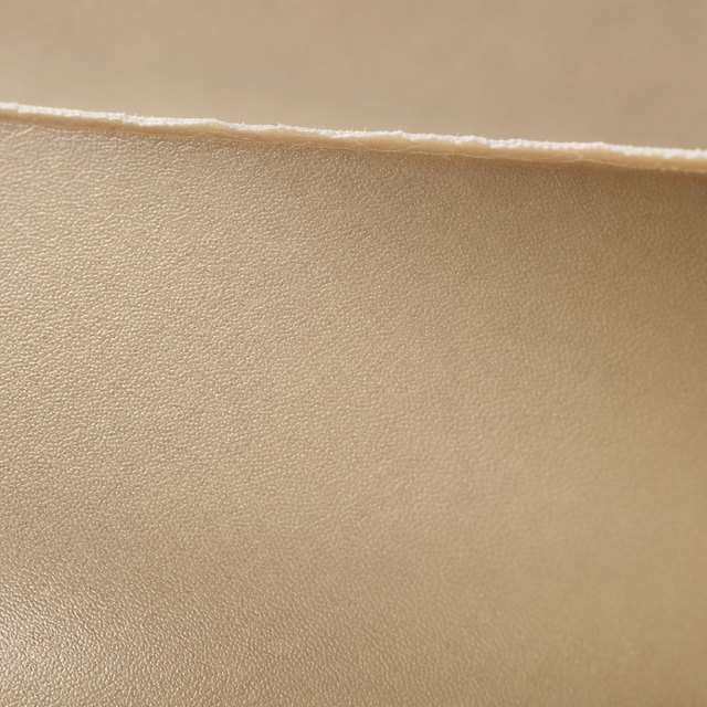 Soft-touch matte navy surface with a fine orange-peel film texture