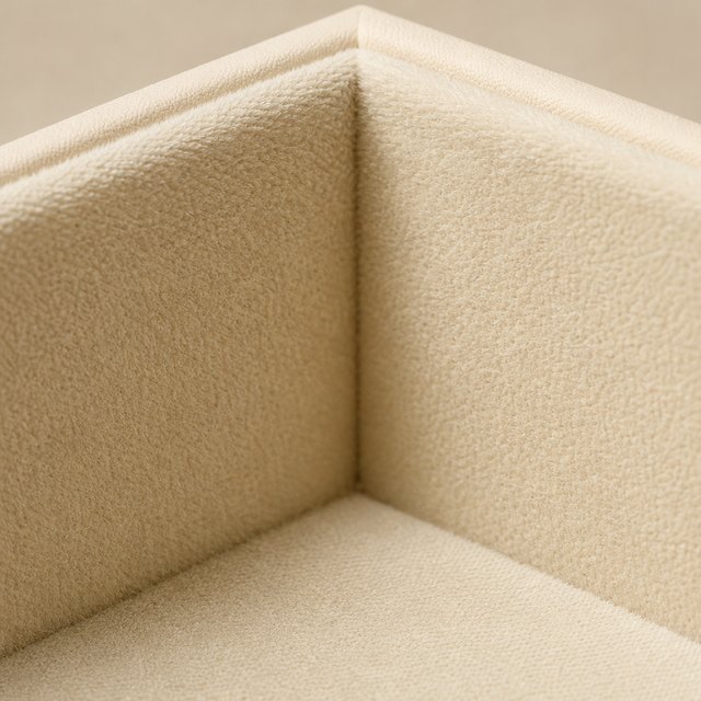 Navy velvet lining inside a rigid box, with the fibre pile visible