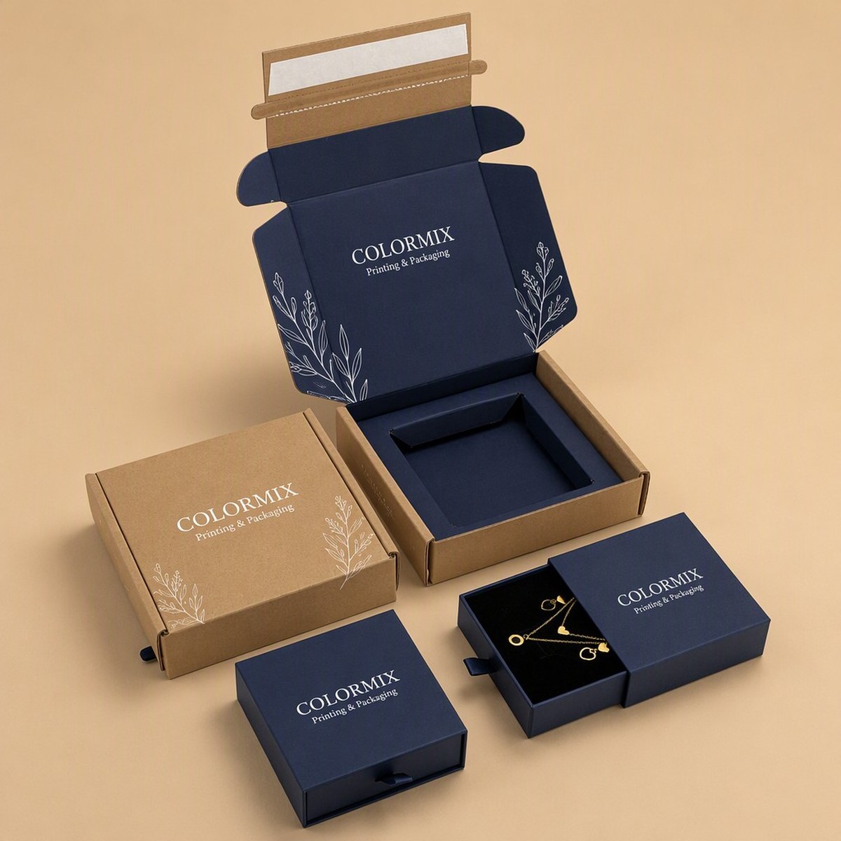 Custom printed box set for a jewellery range: kraft mailer, rigid drawer box and magnetic flip-lid box, all foiled with the customer logo