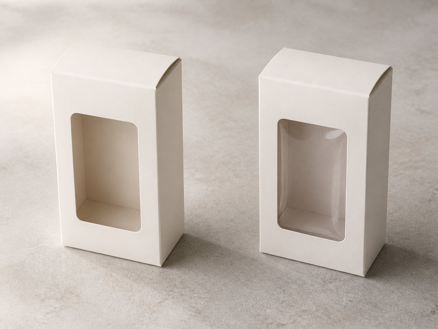 Two folding cartons side by side, one with an open die-cut aperture and one with a clear film window